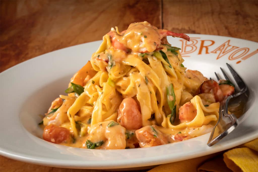 Lobster & Shrimp Fettuccine from Bravo sitting on a wooden table